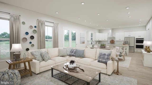 living room featuring light wood-type flooring and recessed lighting