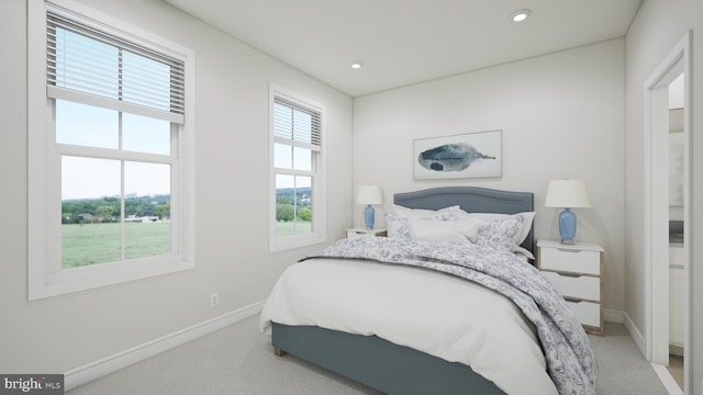 bedroom featuring recessed lighting, light colored carpet, and baseboards