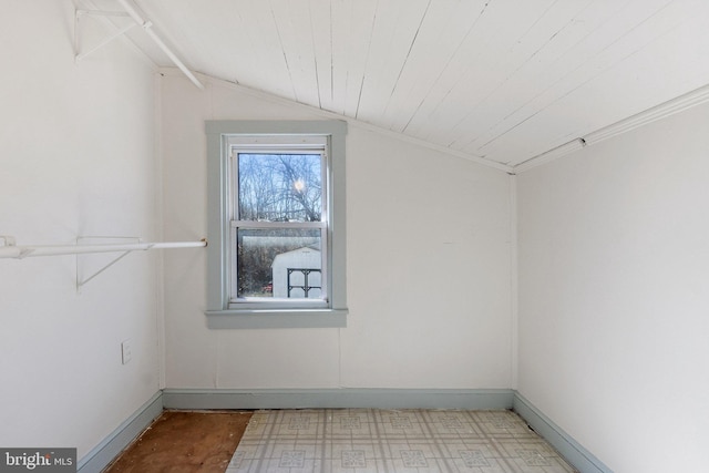 bonus room with lofted ceiling, wooden ceiling, tile patterned floors, and baseboards