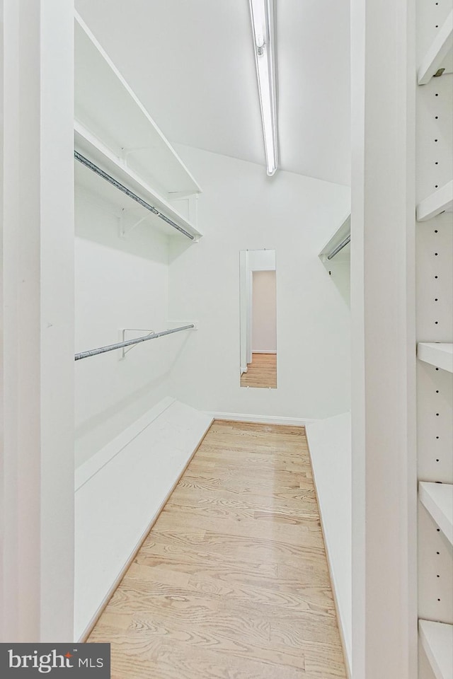 spacious closet with wood finished floors