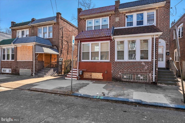 view of front of home with brick siding