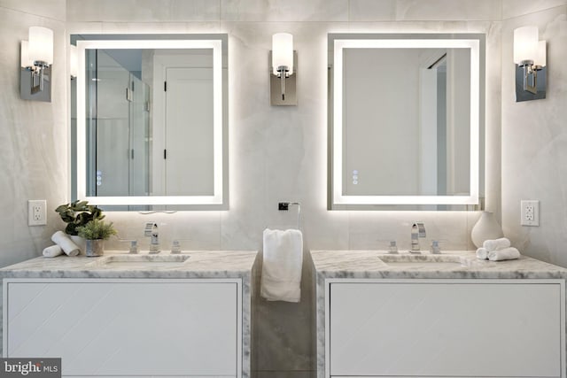 bathroom with two vanities and a sink