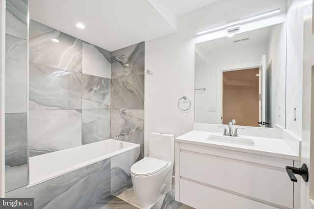 bathroom featuring shower / bath combination, visible vents, toilet, and vanity