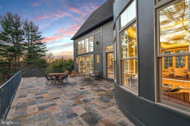 patio terrace at dusk with outdoor dining space