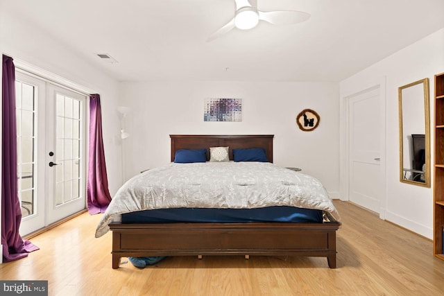 bedroom featuring ceiling fan, visible vents, access to exterior, french doors, and light wood-type flooring