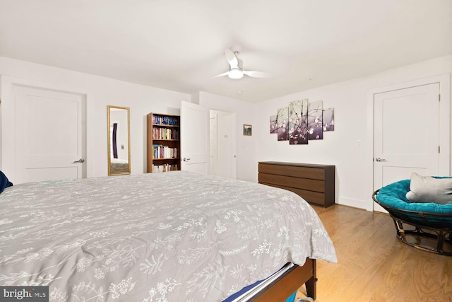 bedroom featuring light wood finished floors and ceiling fan