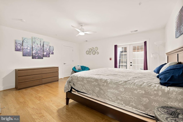 bedroom featuring access to exterior, french doors, visible vents, light wood-style flooring, and a ceiling fan