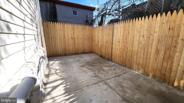 view of patio featuring fence