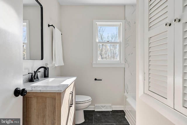 full bath featuring tile patterned flooring, toilet, visible vents, vanity, and baseboards