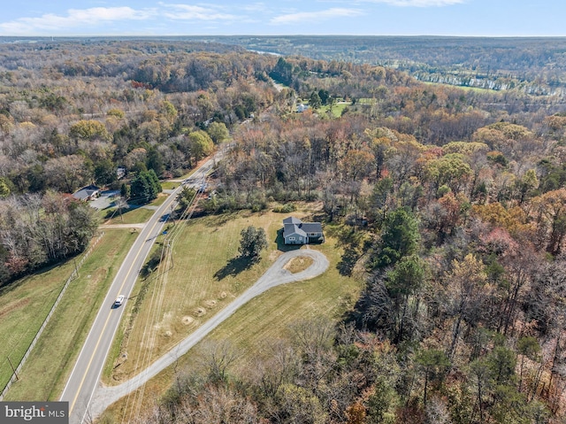 drone / aerial view with a view of trees