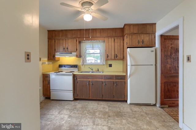 659 E Maple St, Annville, PA 17003 - kitchen with ceiling fan, a sink, light countertops, under cabinet range hood, and white appliances
