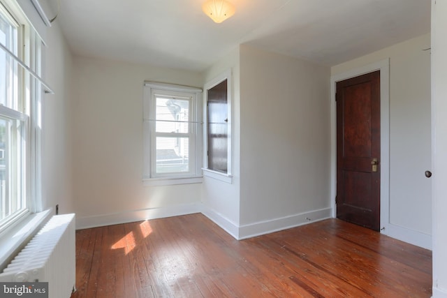 659 E Maple St, Annville, PA 17003 - unfurnished room with radiator heating unit, baseboards, and hardwood / wood-style floors