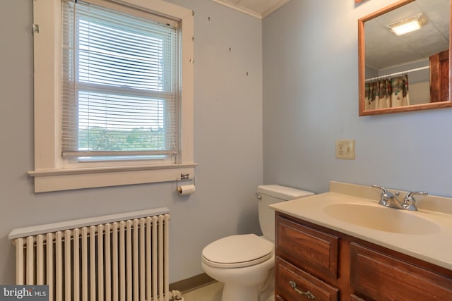 659 E Maple St, Annville, PA 17003 - bathroom featuring vanity, crown molding, toilet, baseboards, and radiator heating unit
