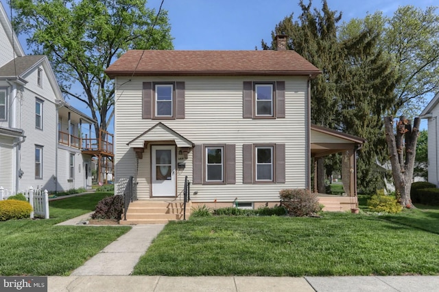 659 E Maple St, Annville, PA 17003 - view of front of home with roof with shingles, a front yard, and a chimney