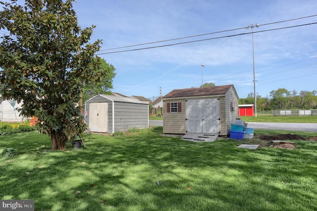 659 E Maple St, Annville, PA 17003 - view of yard featuring a storage unit and an outbuilding
