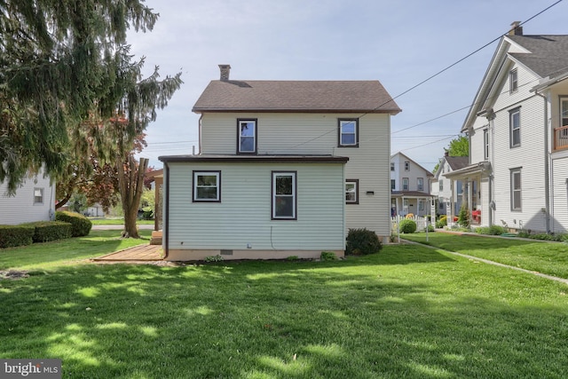 659 E Maple St, Annville, PA 17003 - rear view of house with a lawn and a chimney