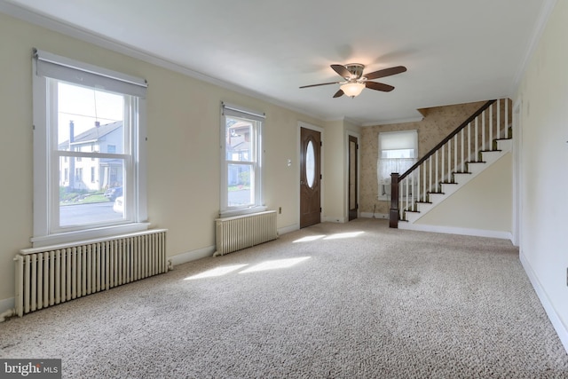 659 E Maple St, Annville, PA 17003 - carpeted foyer entrance with radiator heating unit, ornamental molding, stairway, and a ceiling fan