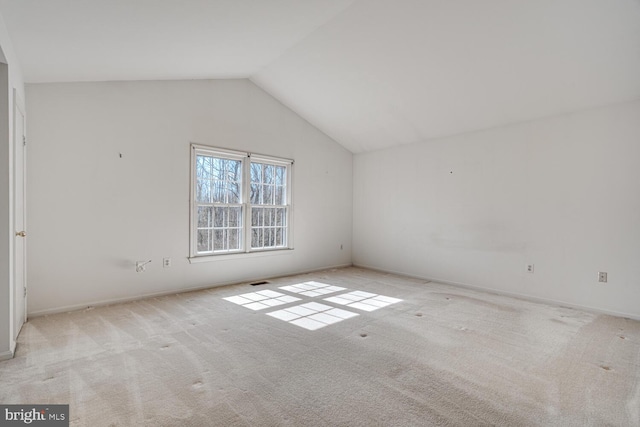 bonus room featuring carpet, visible vents, and vaulted ceiling