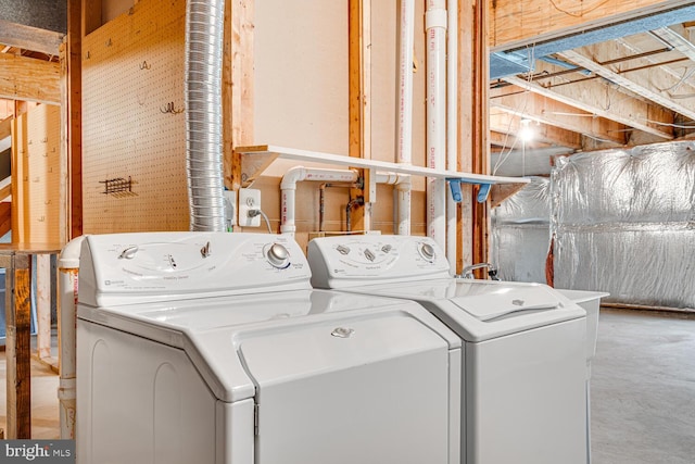 laundry room featuring laundry area and washing machine and dryer