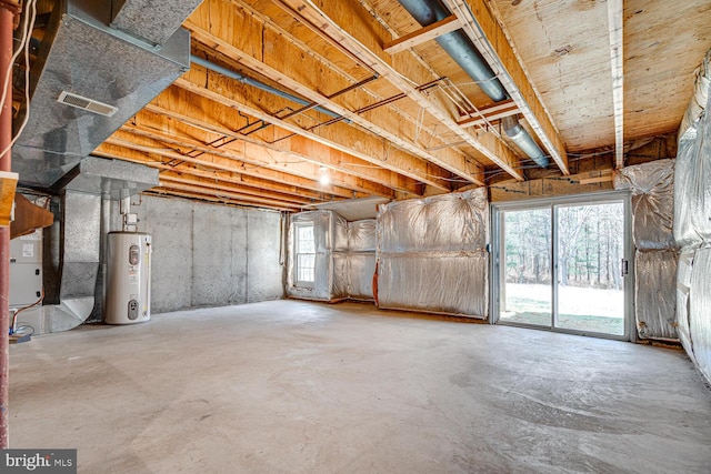 below grade area with electric water heater and visible vents