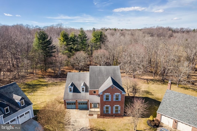 aerial view with a wooded view