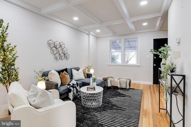 living room with beamed ceiling, coffered ceiling, and light wood-style flooring