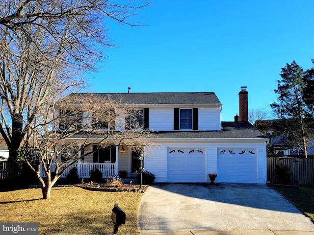 traditional-style house featuring concrete driveway, a chimney, covered porch, fence, and a front lawn