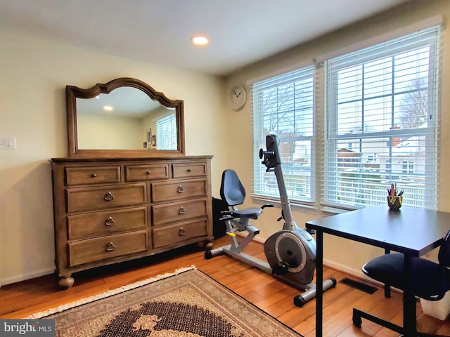 office area featuring light wood finished floors, recessed lighting, and baseboards