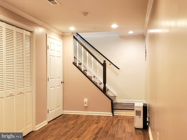 interior space with crown molding, stairway, wood finished floors, and recessed lighting