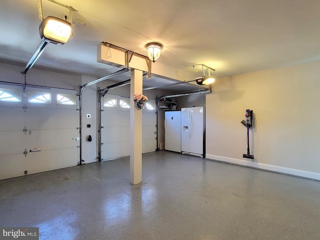 garage with white refrigerator with ice dispenser and a garage door opener