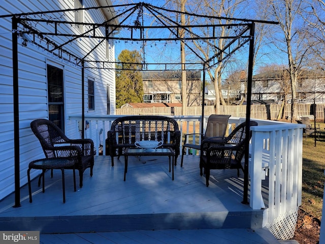 view of patio / terrace featuring fence and a wooden deck