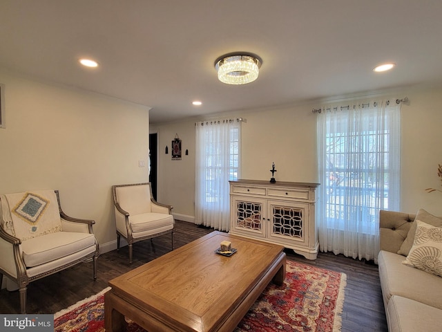 living room featuring a wealth of natural light, dark wood-type flooring, and recessed lighting