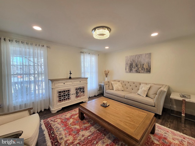 living room featuring dark wood-type flooring and recessed lighting