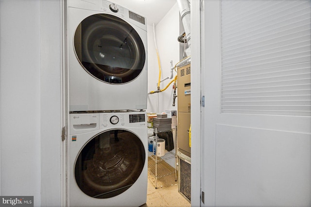 washroom with laundry area and stacked washer and clothes dryer