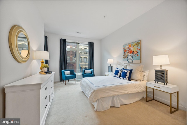 bedroom with light colored carpet