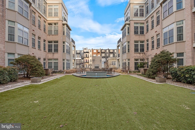 view of community featuring a residential view and a yard