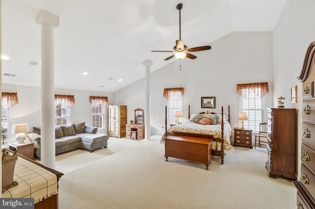 bedroom with visible vents, light carpet, multiple windows, and ornate columns