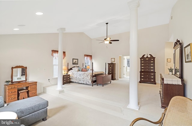 bedroom with recessed lighting, light colored carpet, high vaulted ceiling, and decorative columns