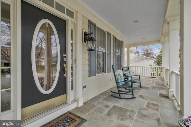 doorway to property with a porch