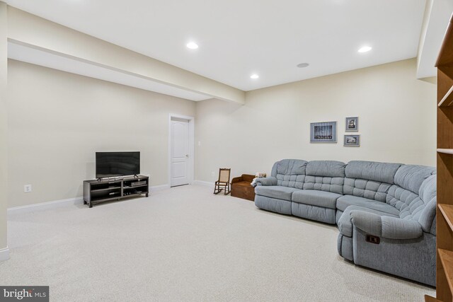 carpeted living room with recessed lighting and baseboards