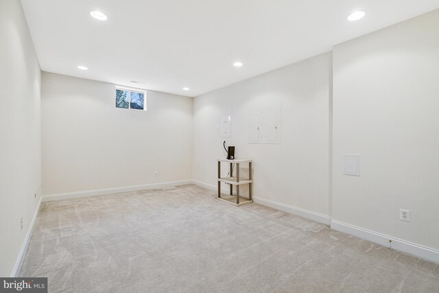 below grade area with recessed lighting, baseboards, and carpet floors