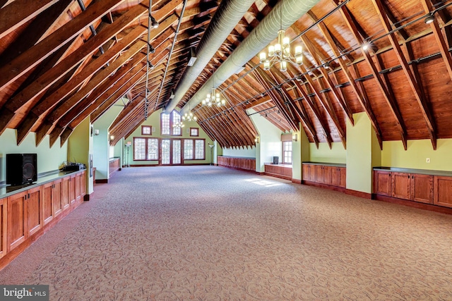 additional living space featuring baseboards, carpet, a chandelier, and vaulted ceiling with beams