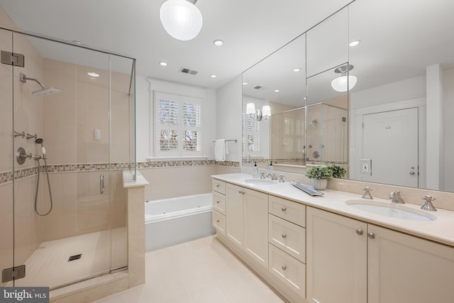 bathroom with a stall shower, visible vents, a sink, and a bath