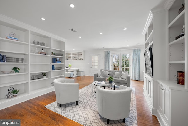 living room featuring recessed lighting, visible vents, and light wood finished floors