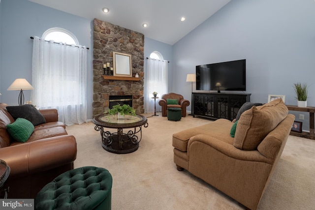 living area featuring carpet floors, a fireplace, high vaulted ceiling, and recessed lighting