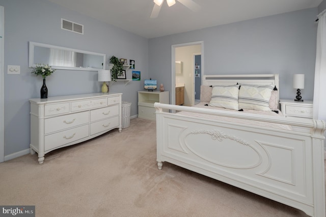 bedroom featuring ceiling fan, connected bathroom, light carpet, visible vents, and baseboards