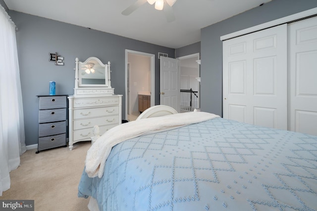 bedroom featuring ceiling fan, a closet, and light colored carpet