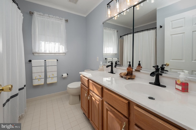 bathroom with toilet, double vanity, visible vents, and a sink