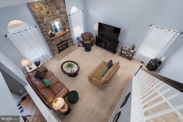 unfurnished living room featuring a fireplace and carpet flooring