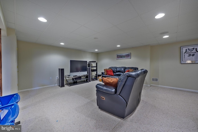 living room with a paneled ceiling, visible vents, baseboards, and recessed lighting